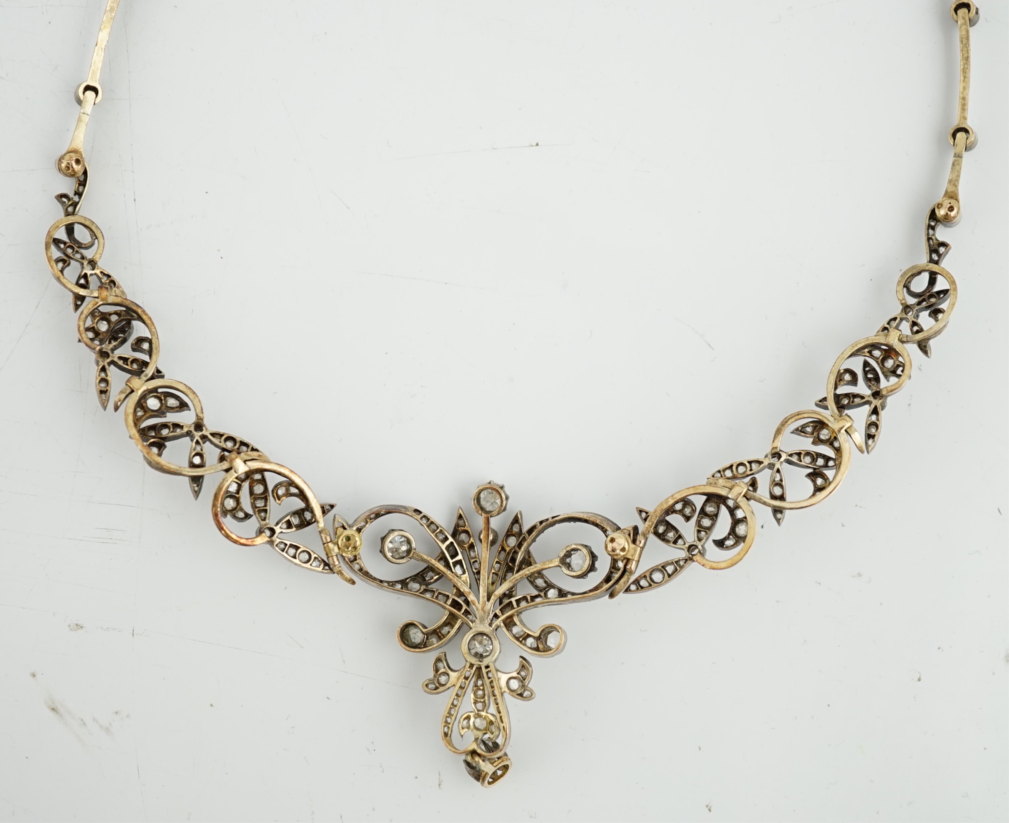A late 19th/early 20th century French 18ct gold and silver, old mine and rose cut diamond cluster set tiara/necklace